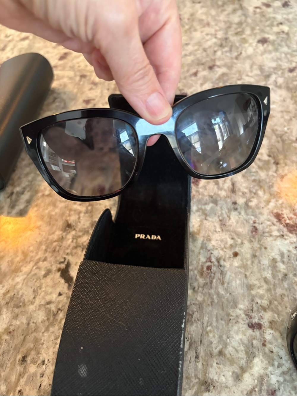 Prada Black Cat-Eye Sunglasses with Subtle Silver Accents